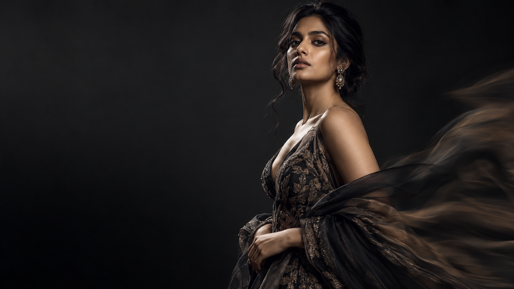 Editorial fashion portrait in dramatic studio light